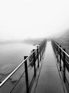 Pedestrian bridge disappears into the fog
